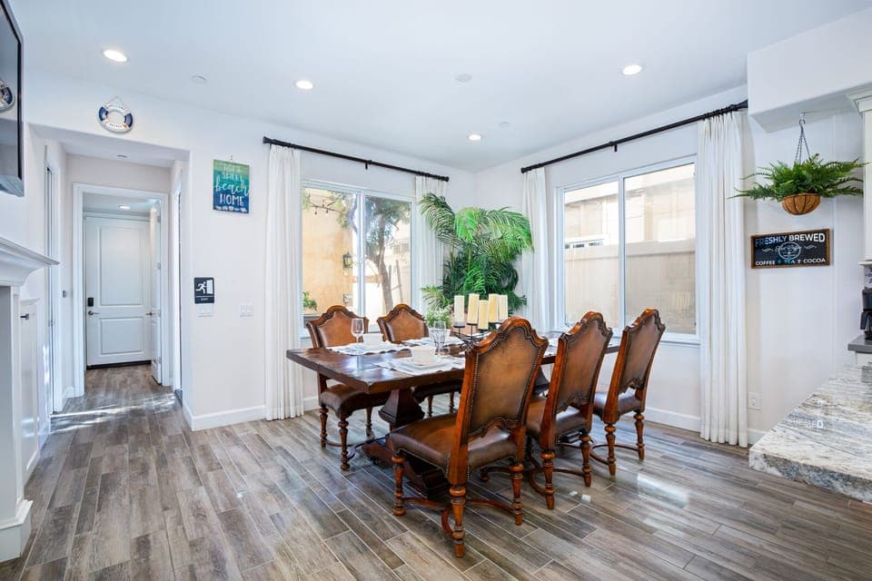 Dining table with 8 chairs. Hope you will book  your next family reunion with us