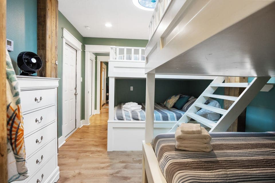 One TipSea Time Mezzanine Bunk Bedroom 4: Located on the mezzanine level, private entrance, sleeps 8 comfortably in custom queen over queen bunk beds. 