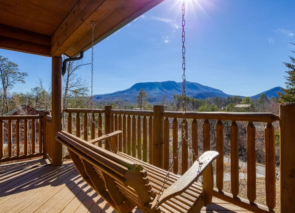 Pigeon Forge Vacation Rental "Magic Views" - Main level back deck with swing