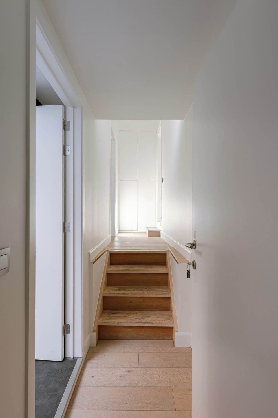 Simple hallway leading to the main living area.
