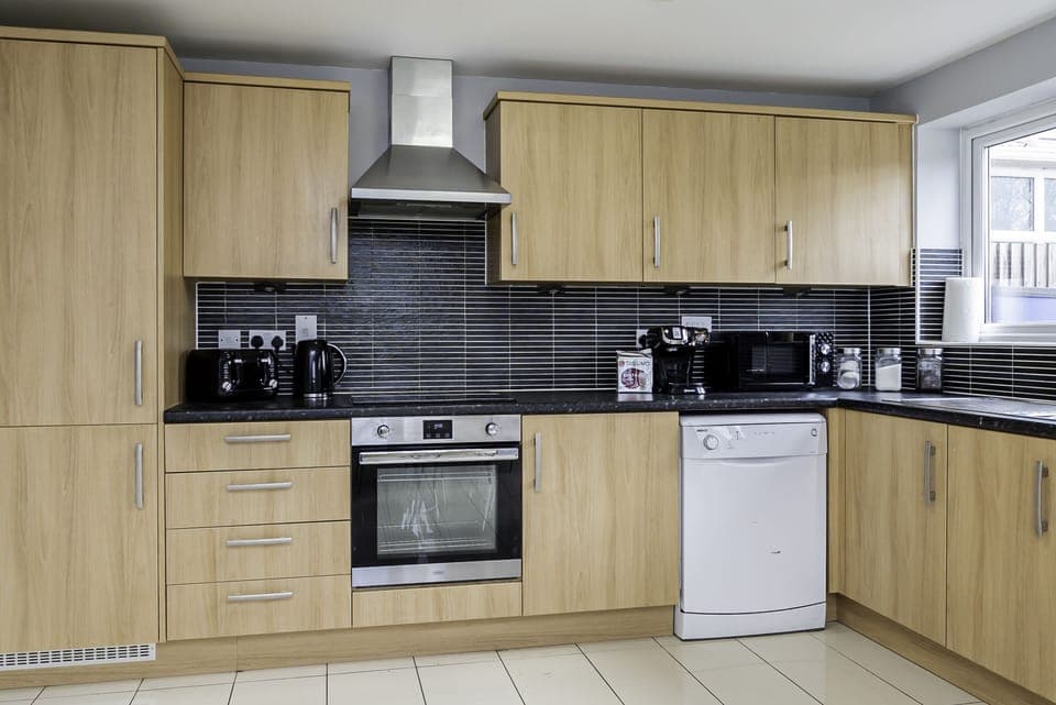 Chic kitchen setup with stylish finishes, ideal for quick snacks and elaborate dinners.
