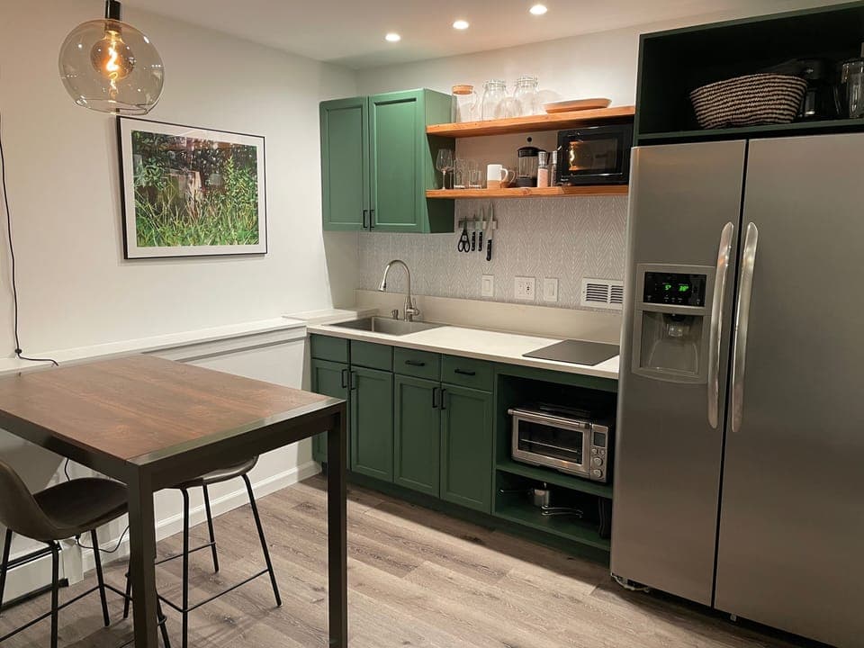 A counter height table offers extra space for meal prep or sit/stand work.