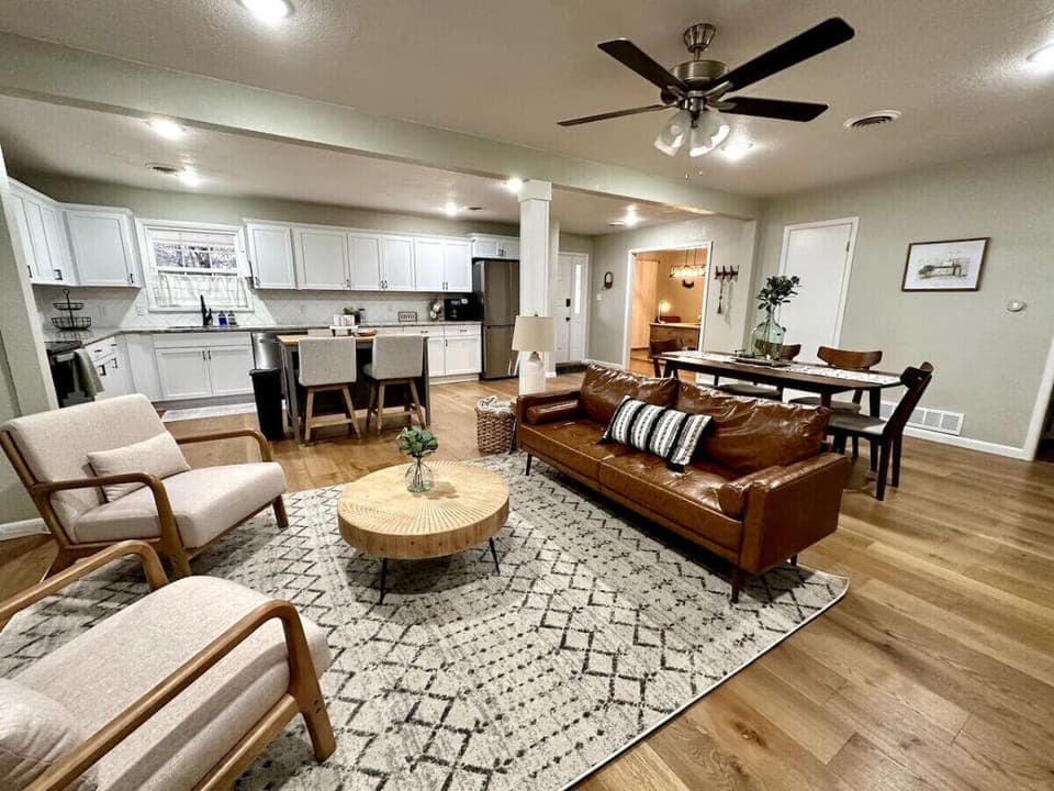 Large, open floor plan with clear views of living room, kitchen, and dining area