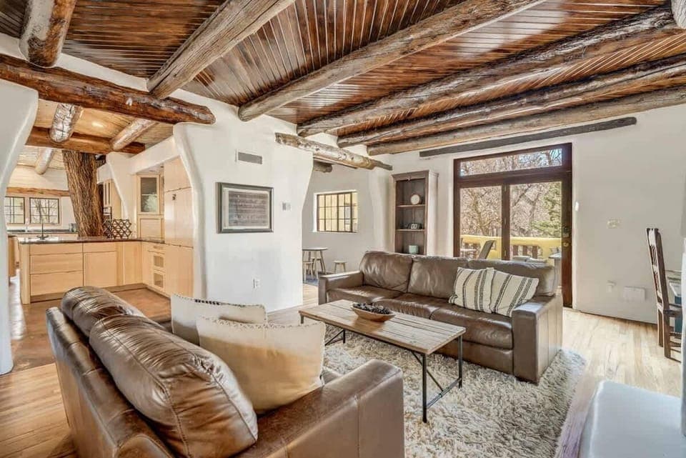 Take a peek into our kitchen, where even the live tree trunk seems to be enjoying the view of our cozy living room—just don't ask it for decorating tips!