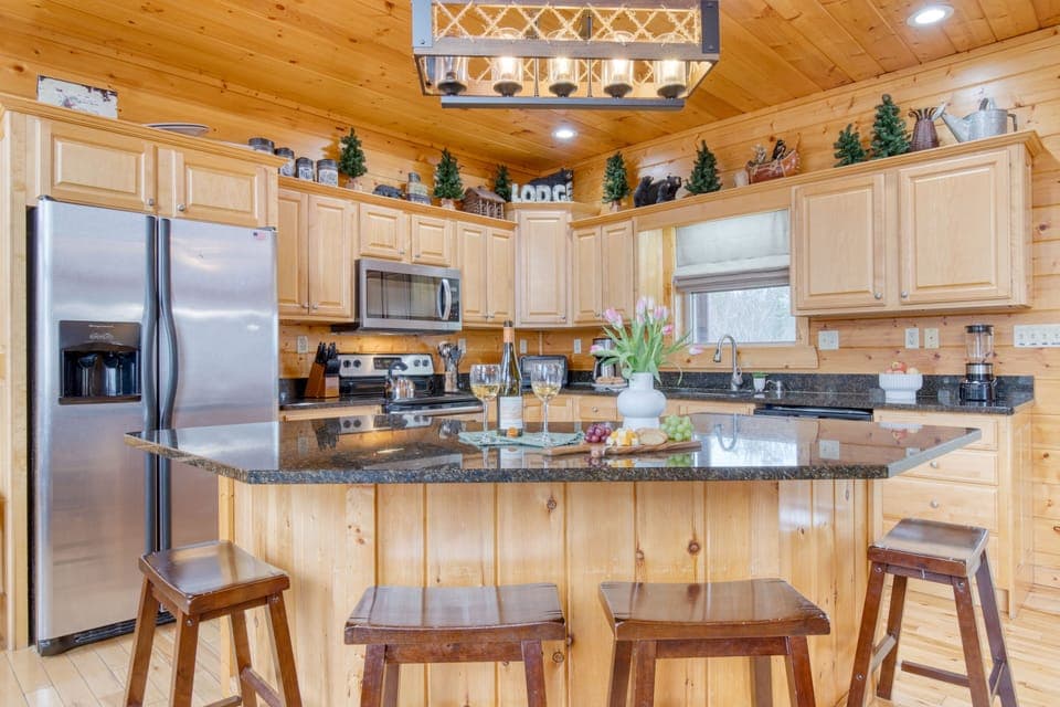 Island with barstool seating in the kitchen.
