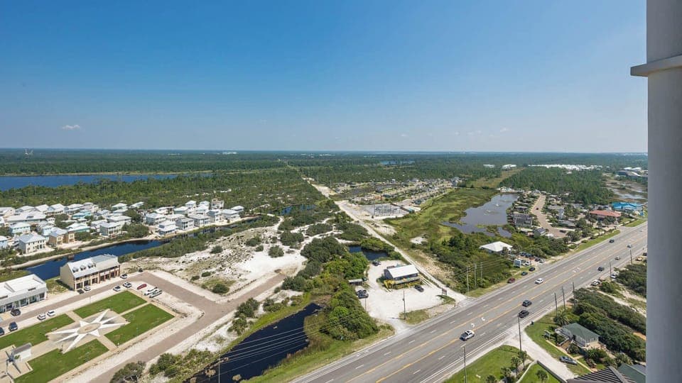 Enjoy panoramic views of lush greenery and waterways from this inviting space, perfect for relaxation and unwinding