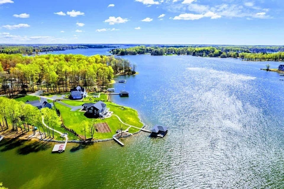 A breathtaking lakeside sanctuary offering stunning water views and direct access to aquatic adventures