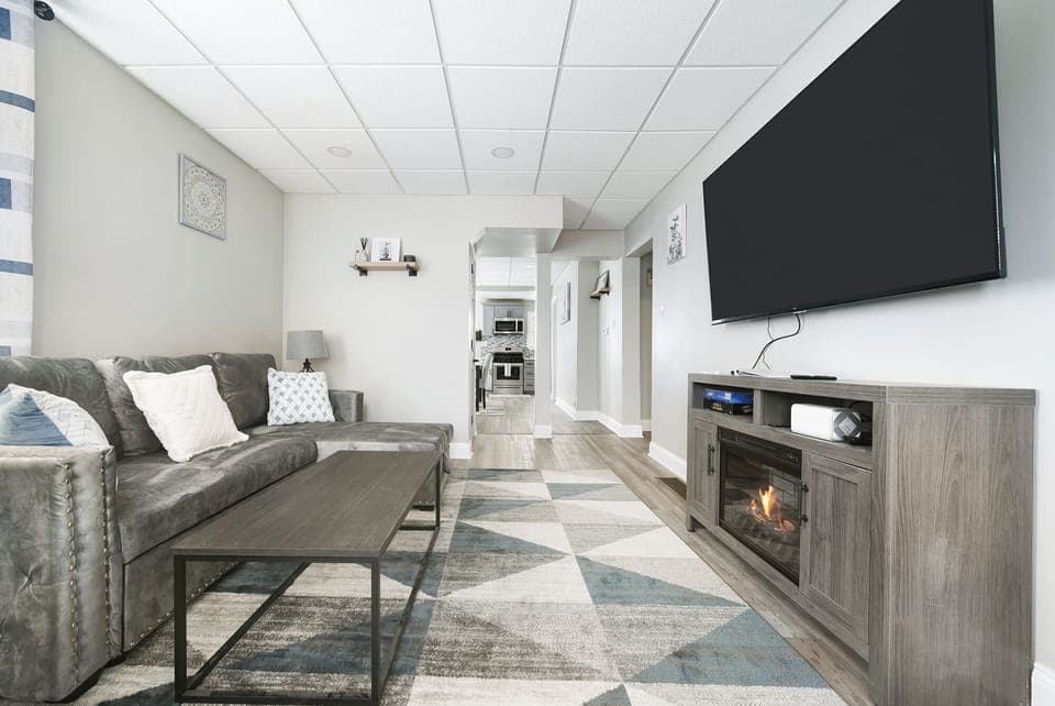 The living room on the ground floor faces the kitchen and dining area. 