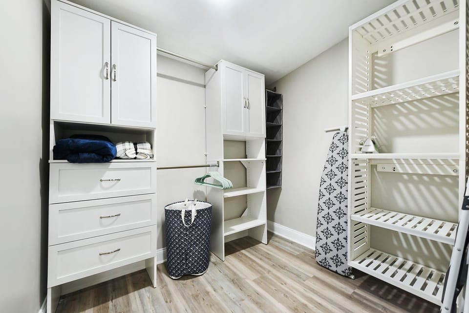 Extra blankets, an iron/ironing board are in the walk-in closet in Bedroom 1. 