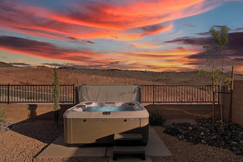 The private, 8 person, hot tub in our fully fenced backyard.