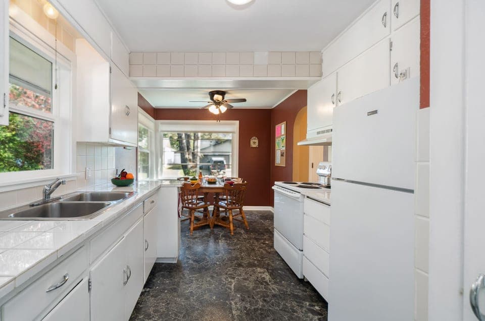 Fully equipped kitchen. Sorry no dishwasher. Open to dining room and access to the garage.