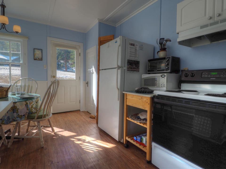 Kitchen is equipped with an oven, full size refrigerator, microwave and toaster oven 