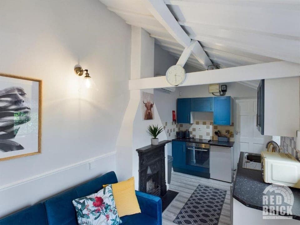 Open plan sitting, tv, dining, kitchen area.