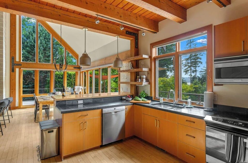 A chef-ready kitchen with forest views, where every meal feels inspired.
