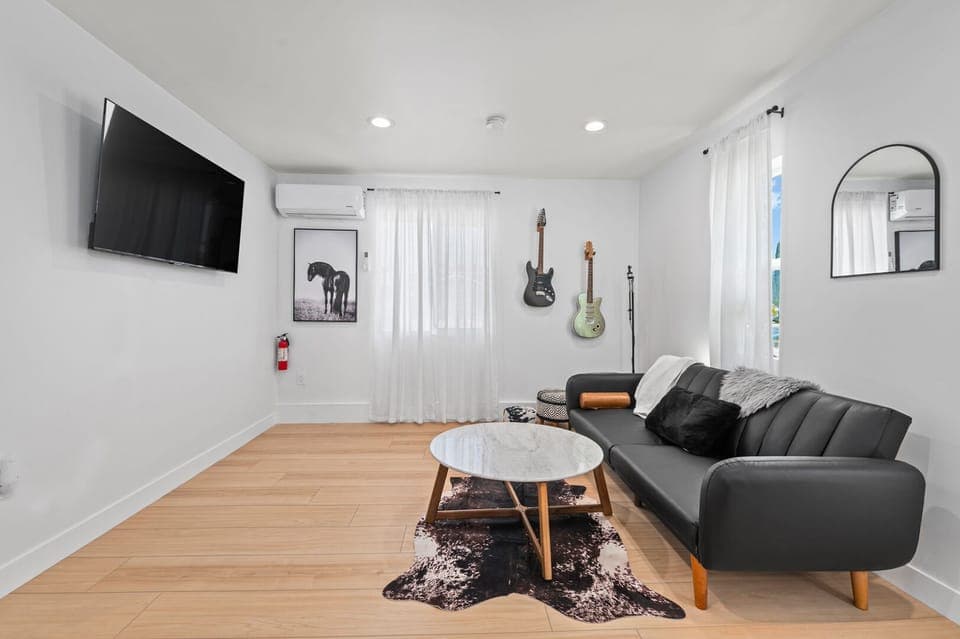 TV w/ wifi to use w/ your streaming services. Mini split AC/Heat in living room.