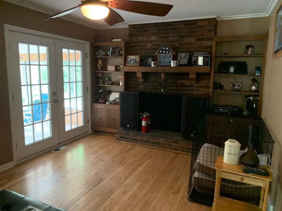 Sitting room: extra large dog crate and sofa bed (not a functional fireplace)