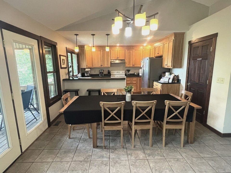 Dining & kitchen view from the living room - deck is pictured on the left 