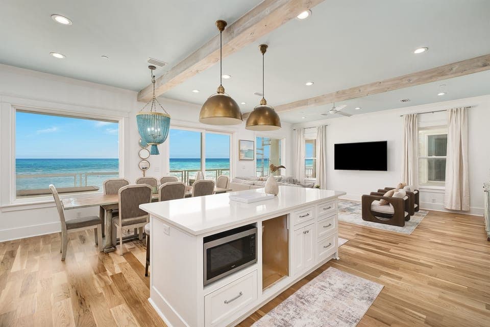 Unwind in this stunning oceanfront space where your morning coffee meets endless sea views through floor-to-ceiling windows.
