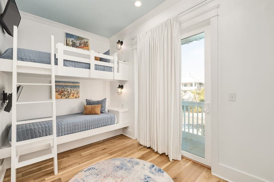 Your kids will love these custom built-in bunk beds with cozy reading nooks and beach views from the private balcony.
