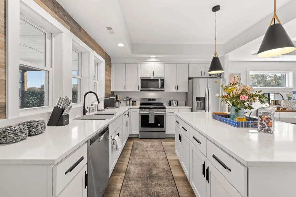 Open concept kitchen w/tons of amenities, and a large island for three.