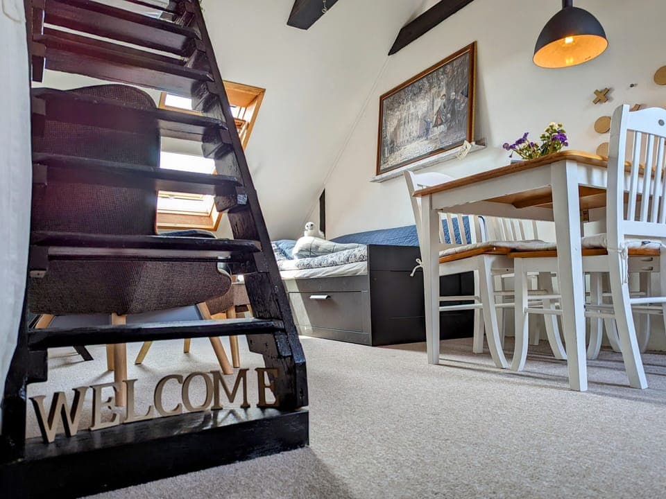 Entrance to the room from the stairway from downstairs