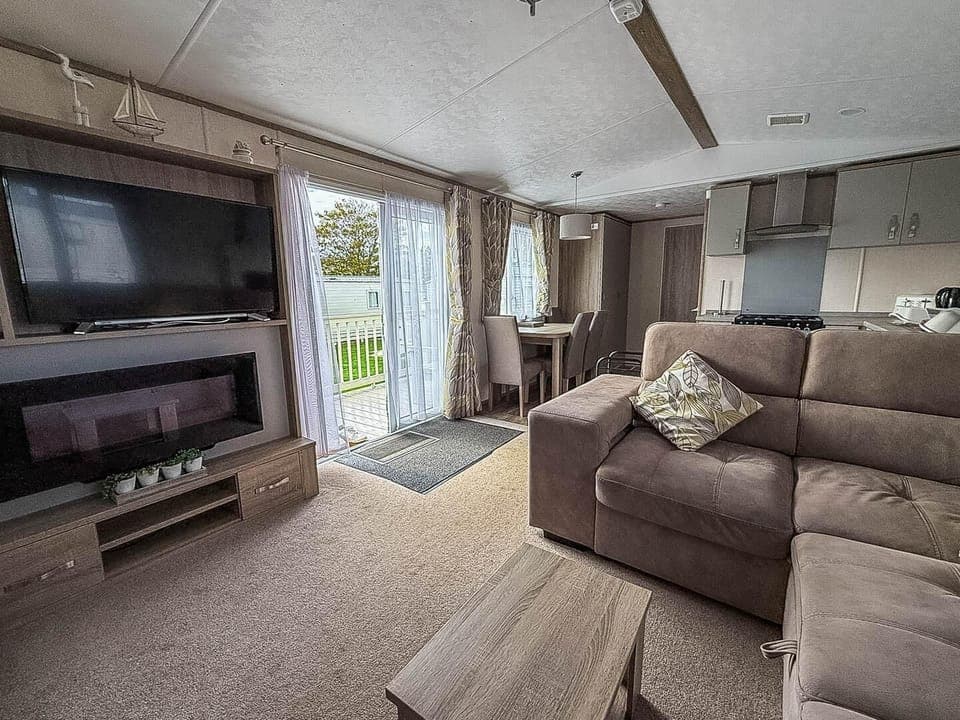 Cozy living room with fireplace and scenic patio access