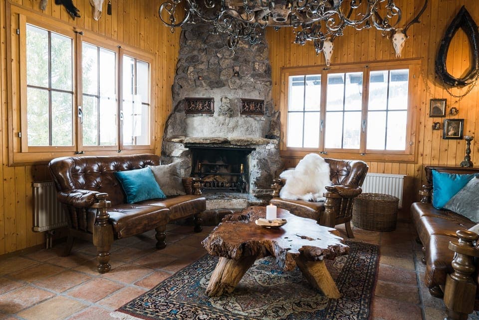 Rustically furnished living room with a fireplace