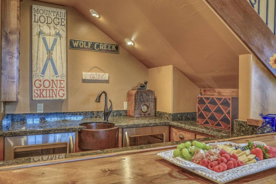 Wine fridge, beer/soda fridge and service ware. Pull up a seat and relax!