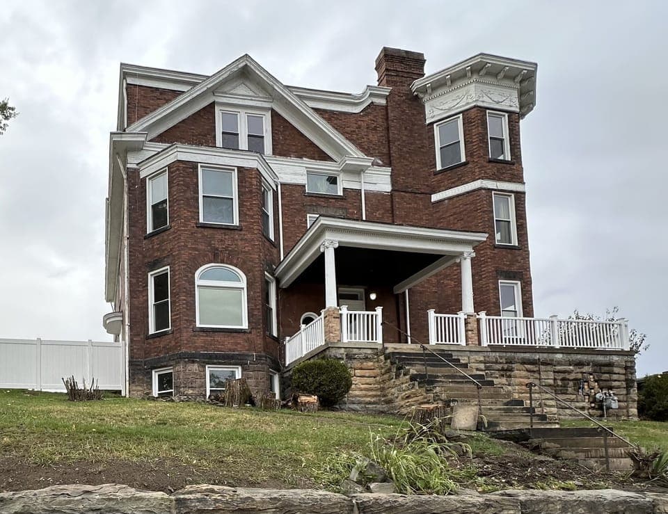 Grand 1210 Tyndal: Victorian mansion blending old-world charm & modern luxury.