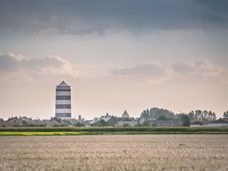 Cloud, Sky, Plant, Atmosphere, Daytime, Building, Natural Landscape, Tree, Tower, Land Lot