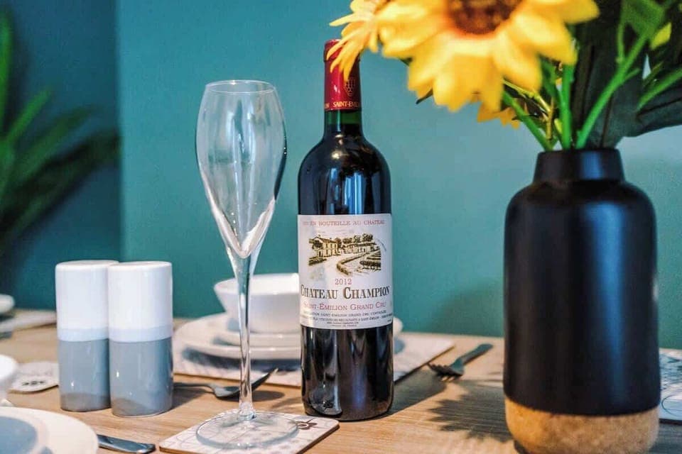 The dining room has a large dining table that can comfortably seat 6 people, perfect for an evening meal.