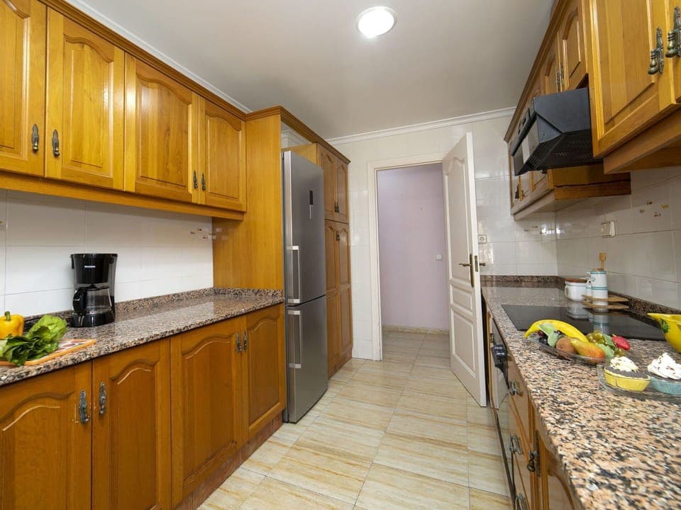 Cabinetry, Countertop, Property, Kitchen, Interior Design, Wood, Lighting, Kitchen Appliance, Architecture, Yellow