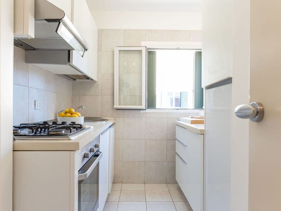 Building, Cabinetry, Window, Kitchen Stove, Kitchen Appliance, Interior Design, Kitchen, Cooktop, Floor