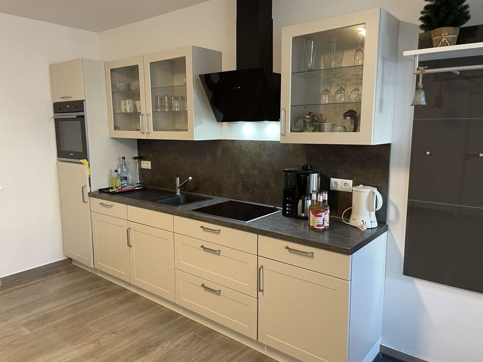 Cabinetry, Countertop, Property, Sink, Tap, Kitchen Stove, Kitchen Appliance, Building, Kitchen, Wood