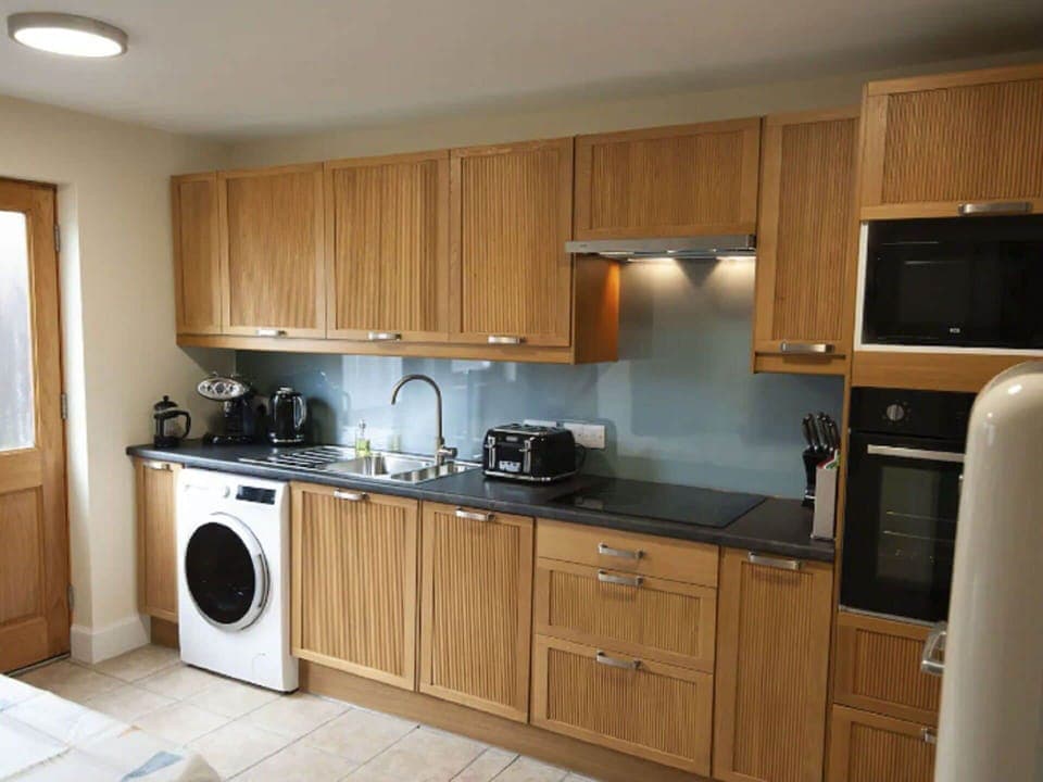 Brown, Cabinetry, Countertop, Property, Sink, Kitchen Appliance, Laundry Room, Kitchen Stove, Kitchen, Wood