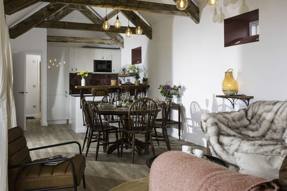 The atmospheric open-plan sitting, kitchen and dining area