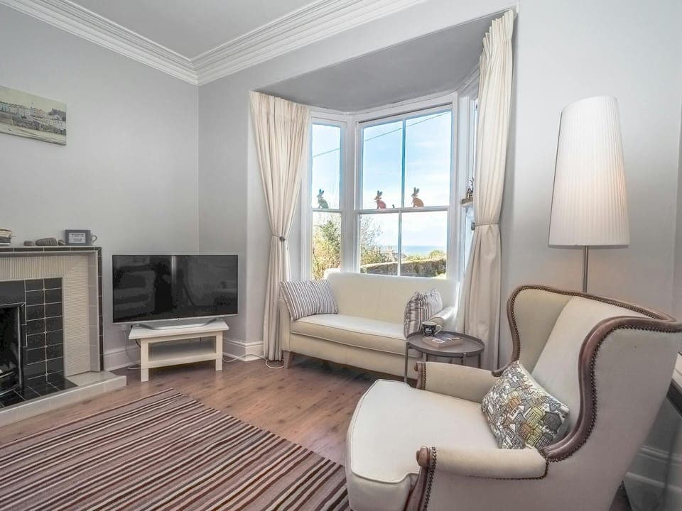 Large bay window with distant sea views