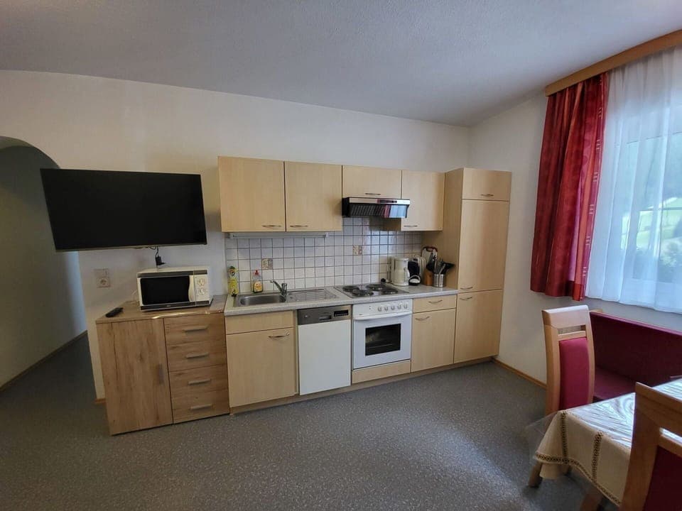 Cabinetry, Furniture, Countertop, Window, Building, Kitchen Stove, Home Appliance, Kitchen Appliance, Curtain, Kitchen