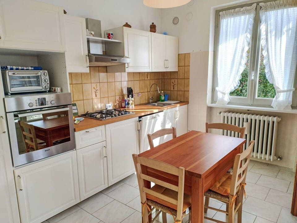 Furniture, Kitchen Appliance, Kitchen, Flooring, Major Appliance, Countertop, Wood, Cabinetry, Interior Design, Floor