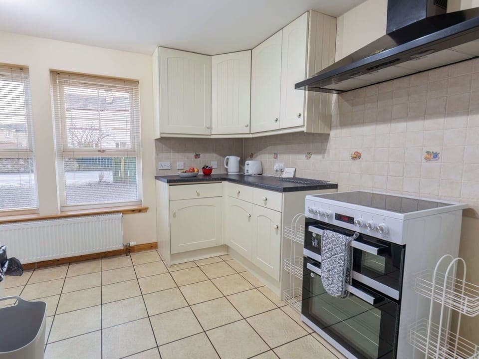 Cabinetry, Countertop, Property, Kitchen Stove, Kitchen, Kitchen Appliance, Window, Home Appliance, Interior Design, Architecture