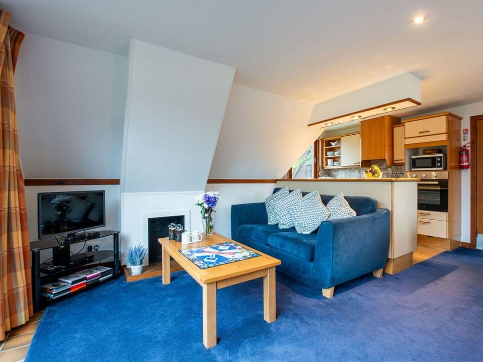 Furniture, Home, Interior Design, Ceiling, Apartment, Chair, Living Room, Resort, Wood Stain, Couch