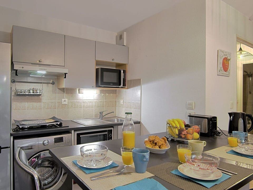 Countertop, Cabinetry, Property, Kitchen, Kitchen Appliance, Table, Tableware, Gas Stove, Kitchen Stove, Home Appliance