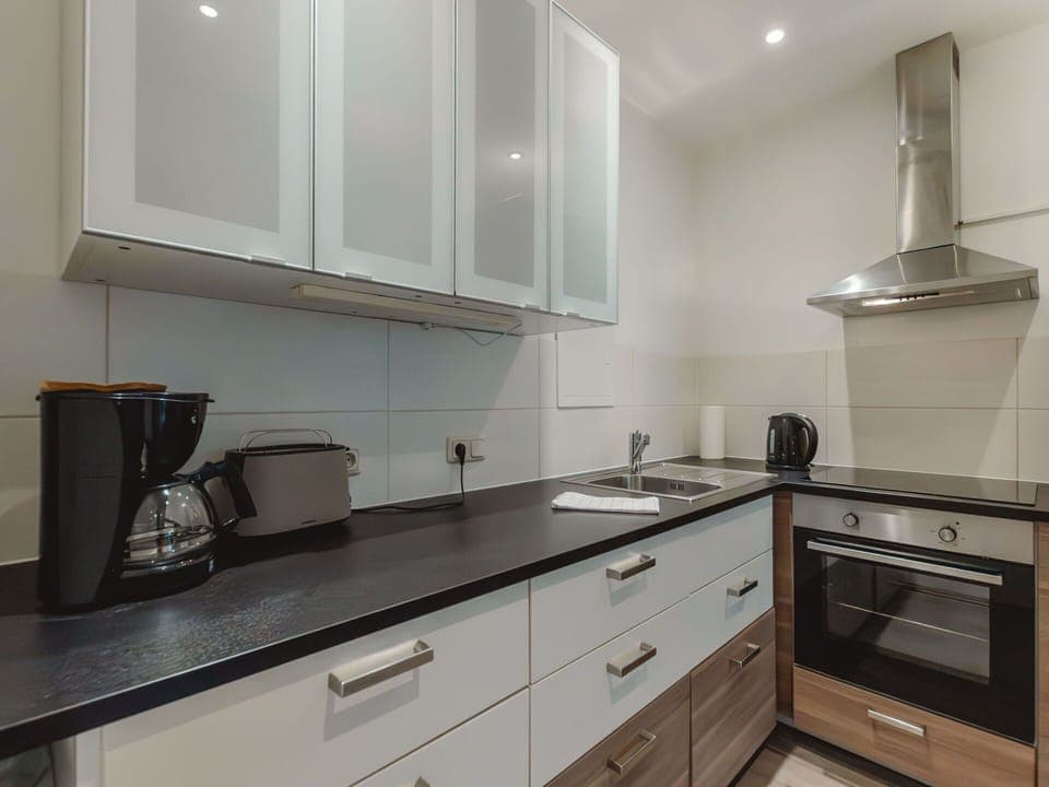 Cabinetry, Countertop, Property, Building, Kitchen, Kitchen Stove, Interior Design, Drawer, Kitchen Appliance