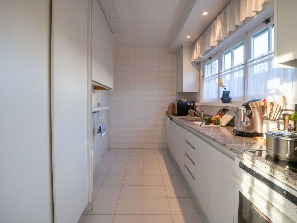 Cabinetry, Countertop, Kitchen Stove, Window, Kitchen, Floor, Kitchen Appliance, Stove, Tap, Wood