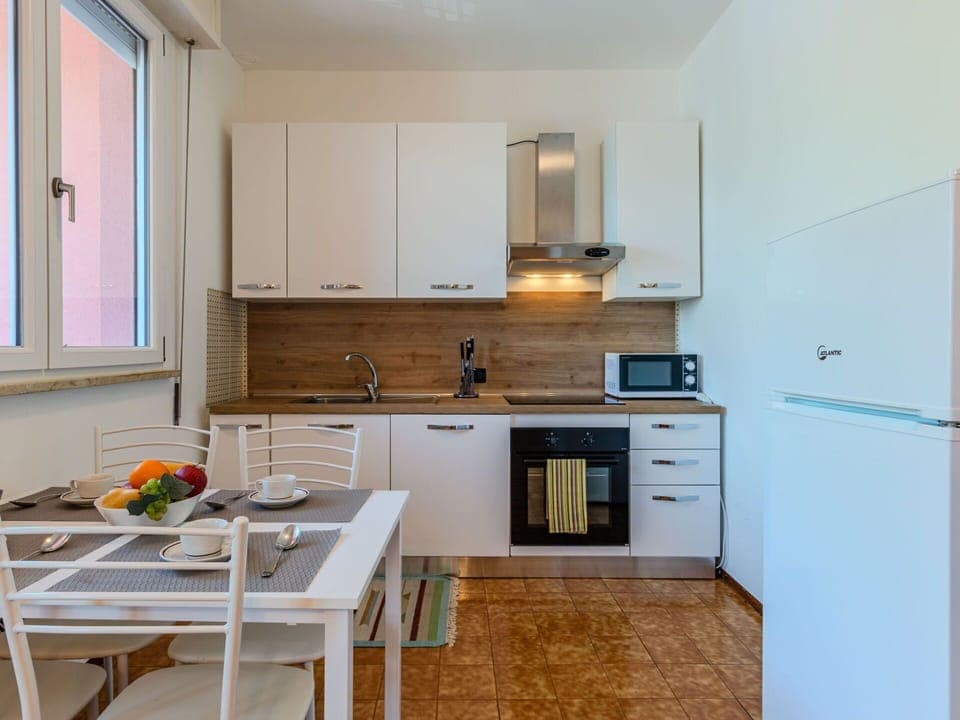 Furniture, Kitchen Appliance, Kitchen, Interior Design, Countertop, Flooring, Major Appliance, Floor, Cabinetry, Wood