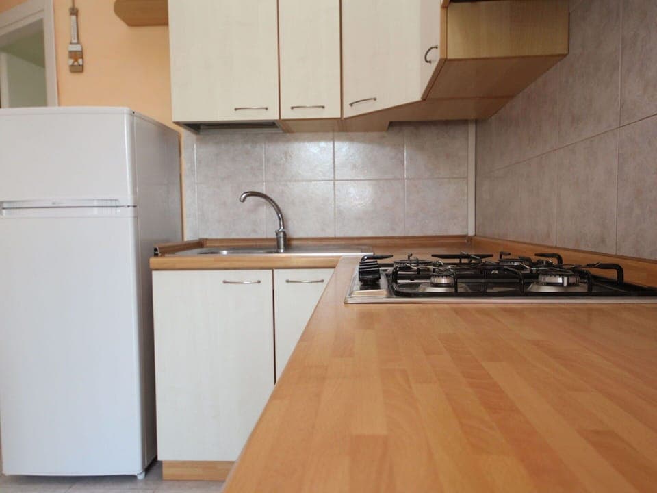 Brown, Cabinetry, Kitchen Sink, Countertop, Building, Kitchen Stove, Kitchen, Kitchen Appliance, Wood, Interior Design