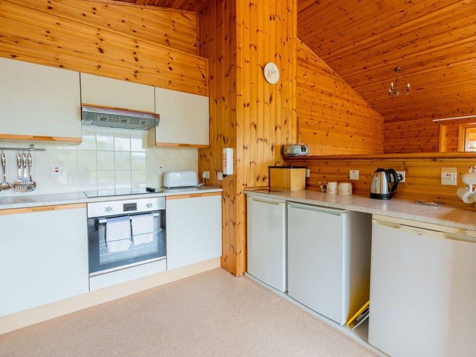 Cabinetry, Countertop, Kitchen Appliance, Kitchen, Wood, Kitchen Stove, Interior Design, Flooring, Floor, Building