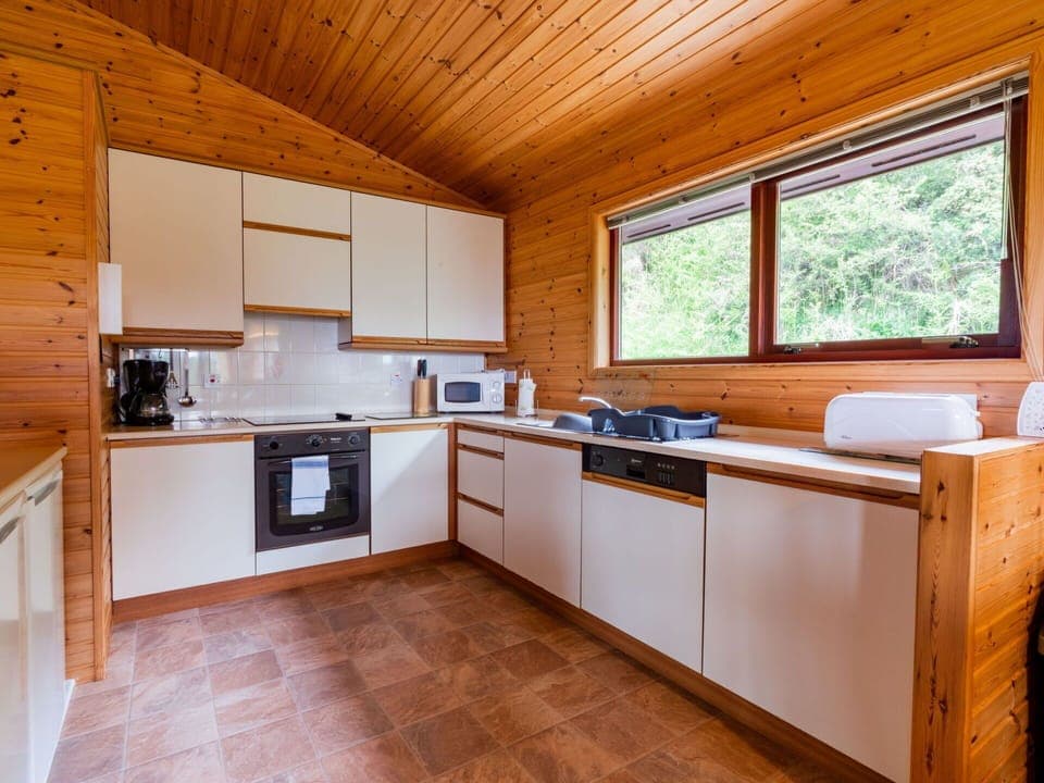 Cabinetry, Countertop, Window, Kitchen Appliance, Kitchen, Kitchen Stove, Wood, Interior Design, Flooring, Floor