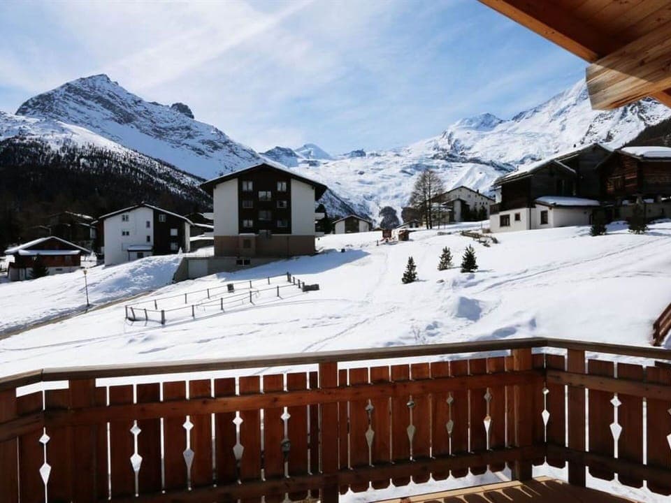 Sky, Cloud, Snow, Mountain, Property, White, Building, Window, Slope, House