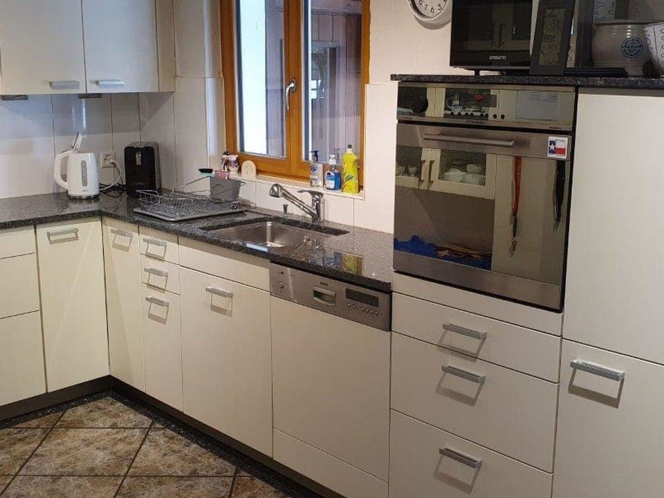 Countertop, Cabinetry, Tap, Sink, Kitchen Sink, Property, Building, Kitchen Stove, Kitchen, Kitchen Appliance